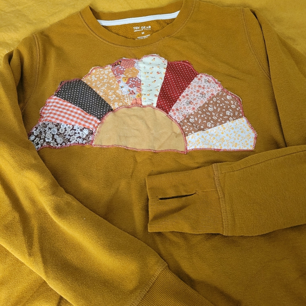 Upcycled quilted sunrise sweatshirt